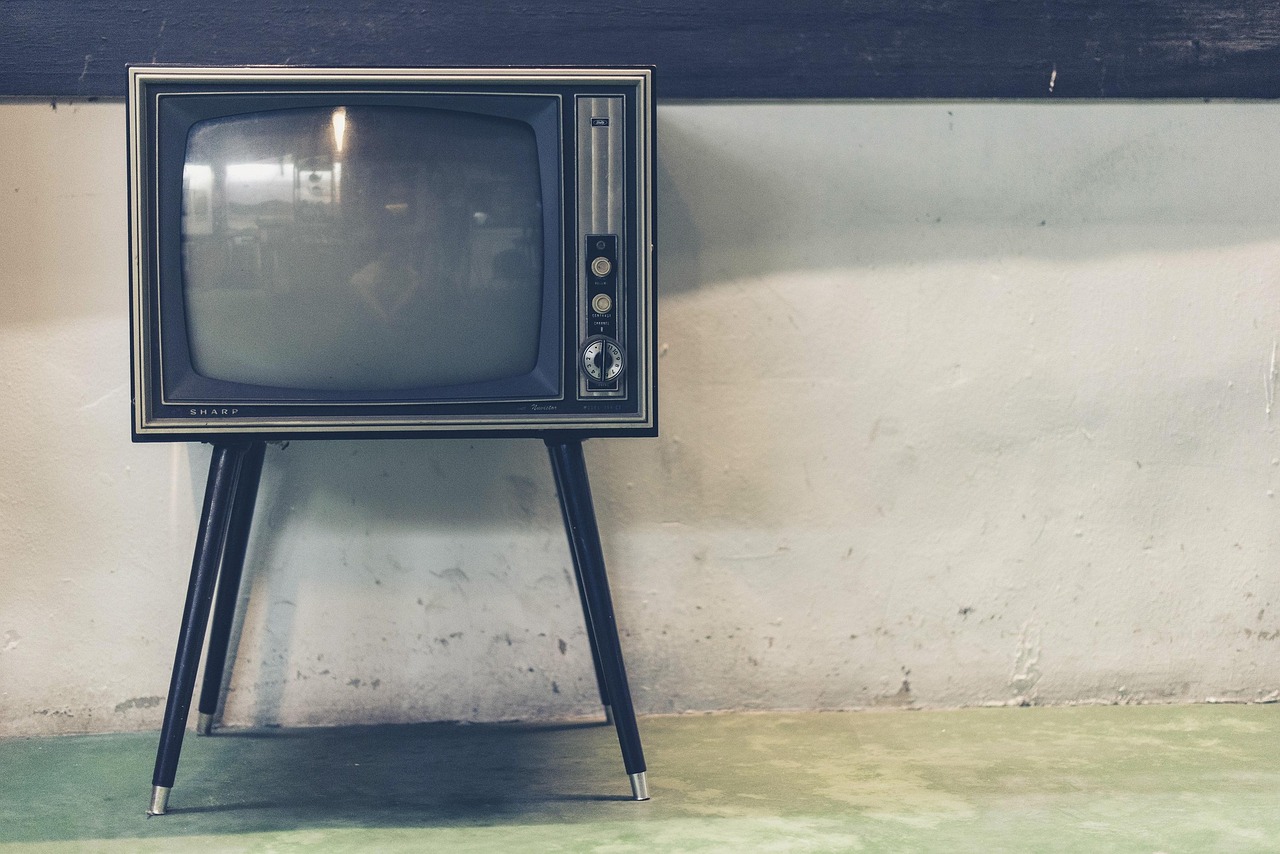 A modern flat-screen television displaying content, representing the final result of a completed IPTV setup.